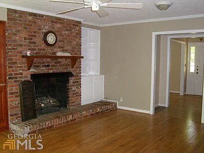 Family room with fireplace and white bookcase