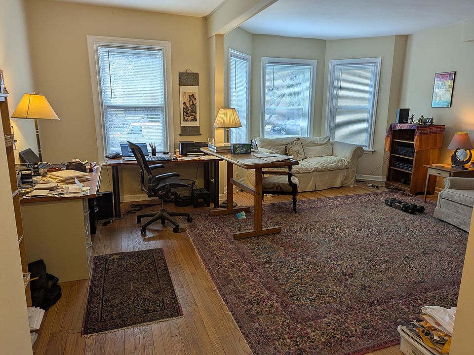 Large airy living room doubles as office.