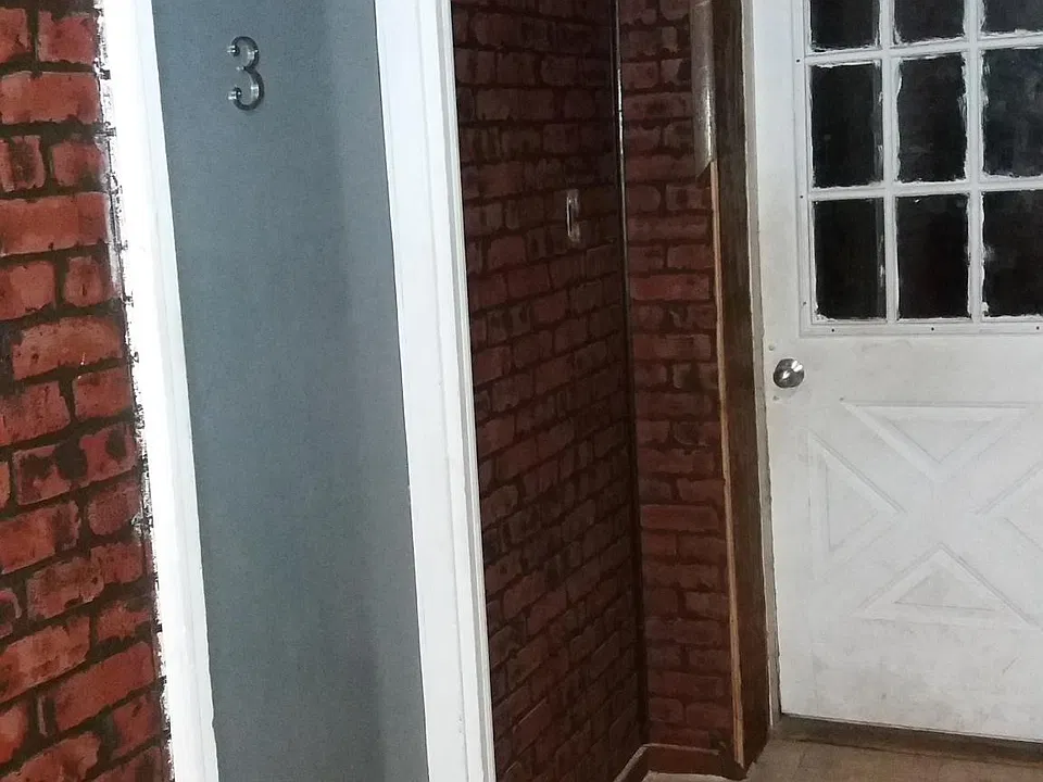 Entrance door from hallway.