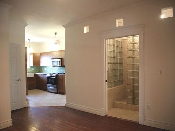 VIEW OF KITCHEN FROM LIVING ROOM