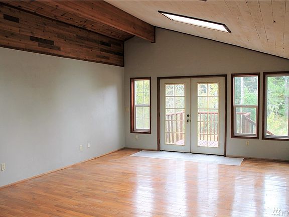 A really BIG bonus room with several skylights to let in a lot of natural light! French Doors lead to a nice little deck overlooking the side yard.