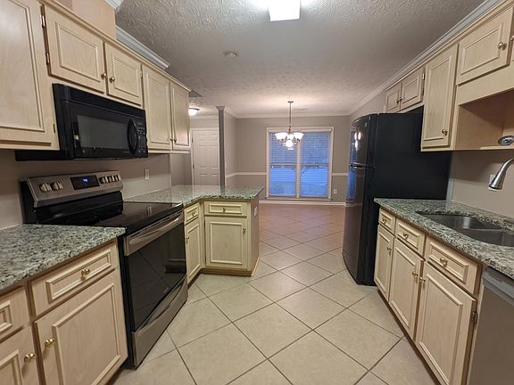 Tiled kitchen and dining area.