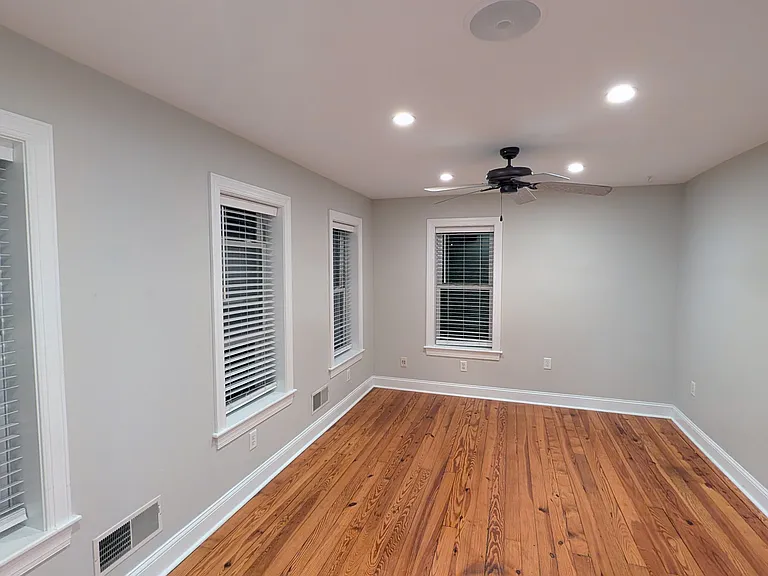 The master bedroom has a dimmer on the recessed lightint and a ceiling fan.