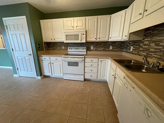 Kitchen with pantry and tile flooring