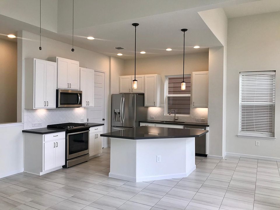 GAS RANGE AND NEW SS REFRIGERATOR