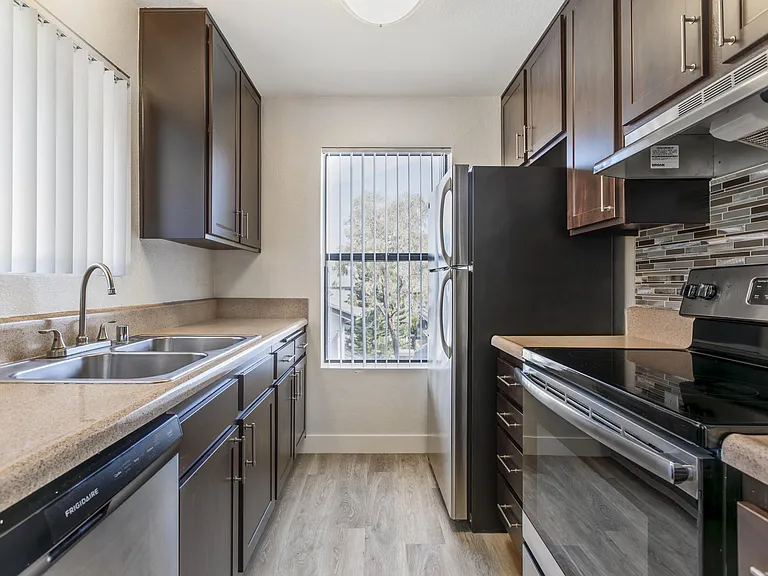 Modern luxury meets comfort at Independence Plaza, where every home boasts a sleek, fully equipped kitchen featuring stainless steel appliances.