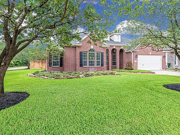 Gorgeous corner lot with mature trees and lush landscaping!