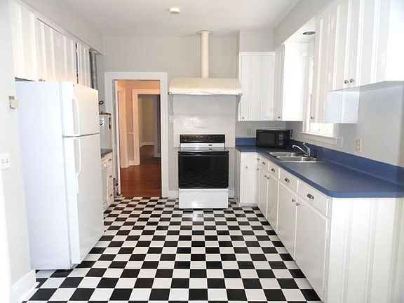 Kitchen with charm, new flooring, cabinet hardware, and retro Vent-a-Hood