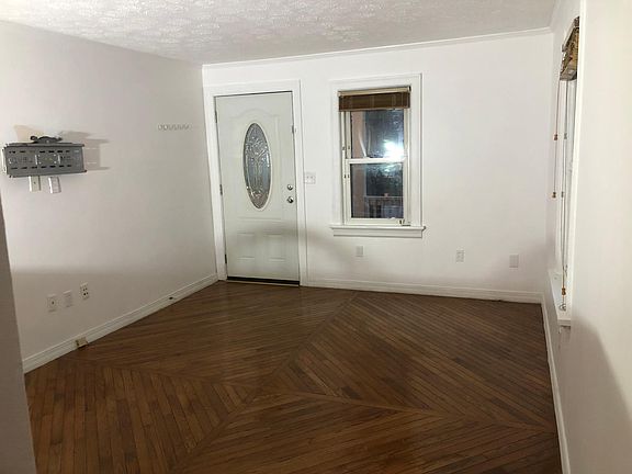 Living room. Front door out to front porch.