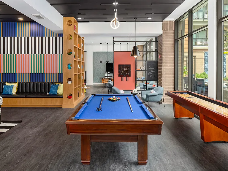 Game Lounge Featuring Billiards, Shuffleboard, and Cozy Lounge Seating