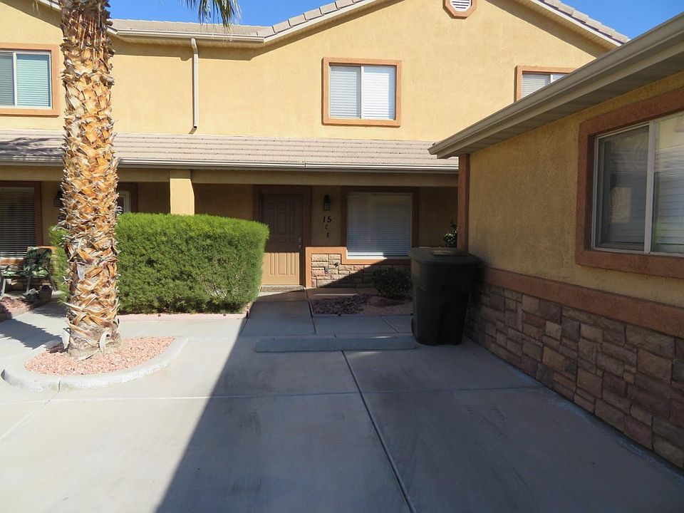Front view of town home - parking alongside the garage