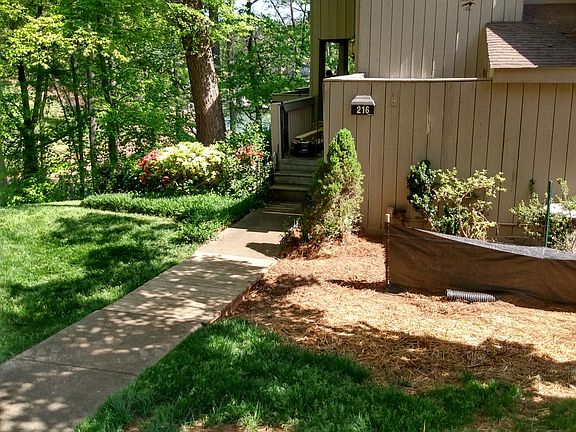 Entry to front entrance & wrap around deck overlooking water.