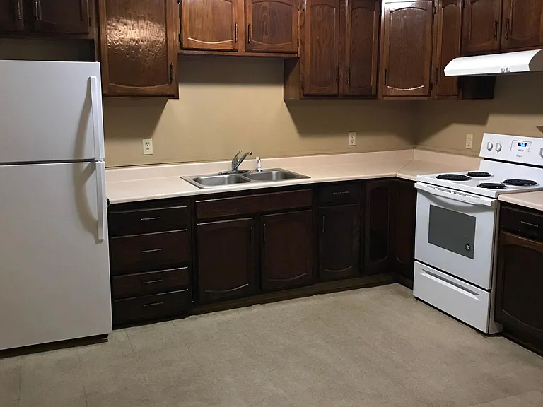 Open Kitchen to dining. Refrigerator, stove/vent.