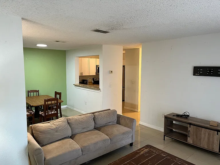 View from Living Room to Dining room and Kitchen