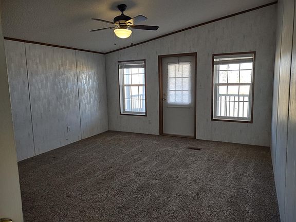 Master bedroom, with access to back patio for morning coffee
