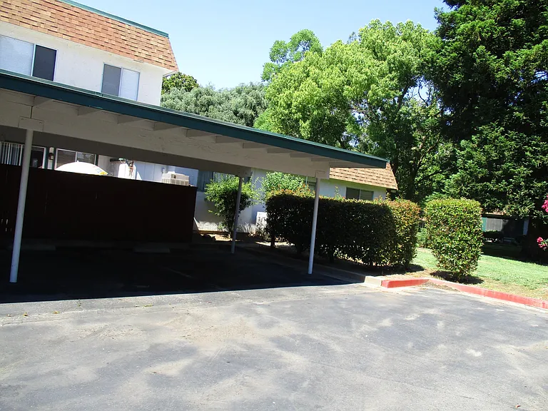2 designated covered parking spaces adjacent to home provided with rental.