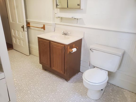 Bathroom with ceramic tile floor.