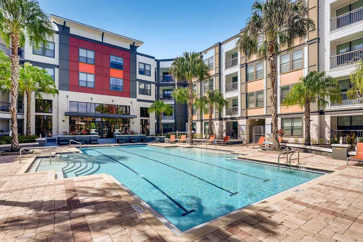 Resort-style swimming pool with lounge chairs - EOS