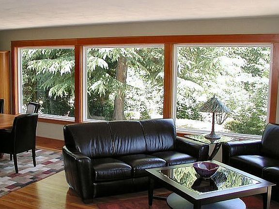 Picture windows in living room bring the outdoors inside