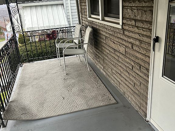 Shaded front porch with privacy.