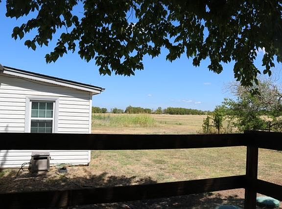 View from the back deck off the kitchen, completely covered by a large tree - plenty of shade!