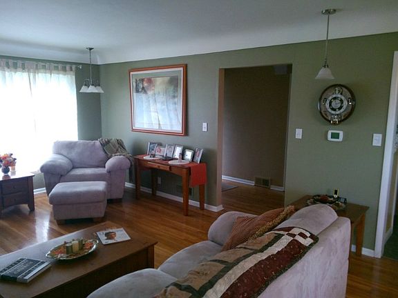Second angle of the formal living room.  An open concept style with the formal dining area at the other end of the room.  