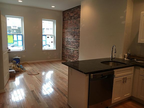 Large windows in the living room make the space luminous and bright.