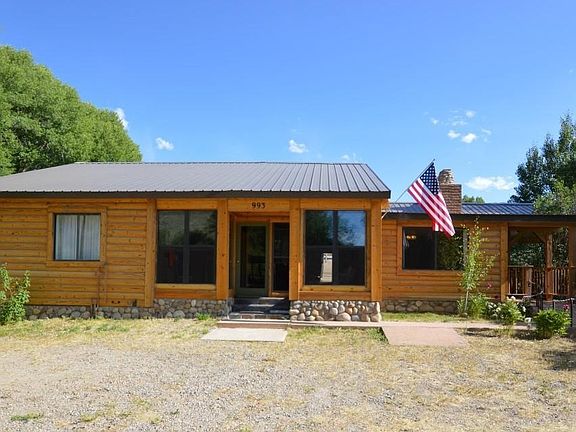 2 bedrooms, 2 full baths, wood burning fireplace, sun porch, covered decks, guest quarters.