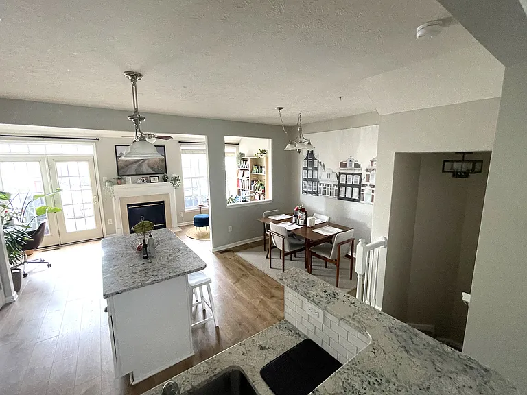Stairwell from entry level leads into kitchen on main level