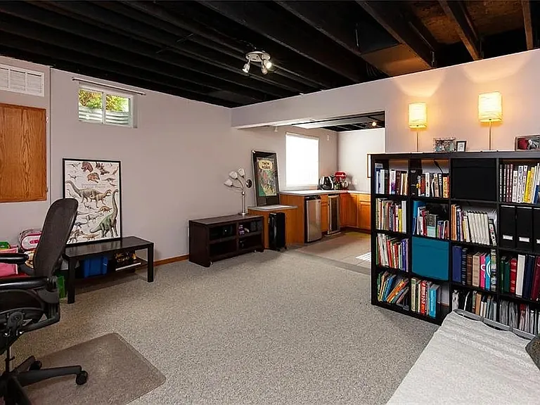 Basement space is perfect for office or rec room. Not shown - next to the kitchenette there is a large space with built-in shelves for storage.