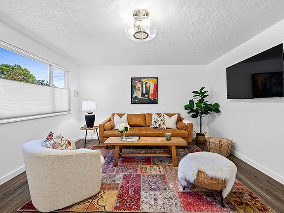 Living room with custom privacy blinds.