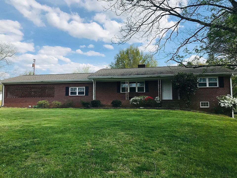 Must see the inside pics ! Updated brick ranch on 3 acres with lots of storage and room to play