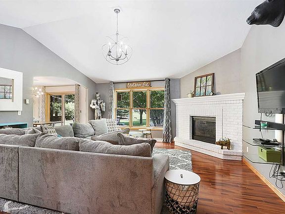 Livingroom has vaulted ceilings and cozy gas fireplace