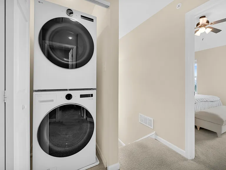 Laundry Area Conveniently Located in the Upstairs Hallway. New LG Washer and Electric Dryer. Enclosure Has Folding Door
