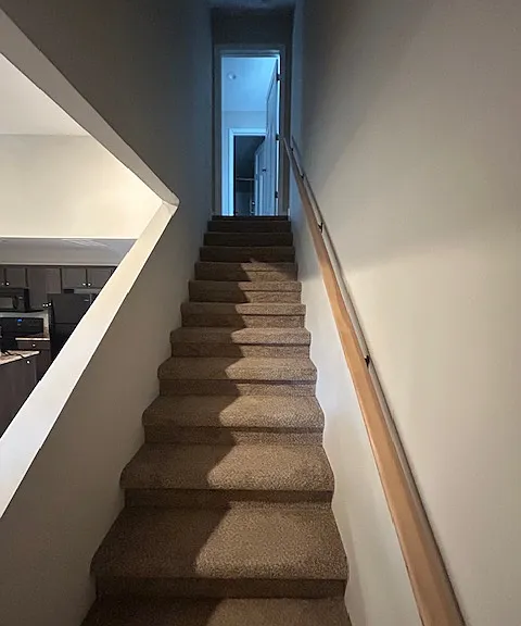 Stairs to the second floor bedroom and bathroom