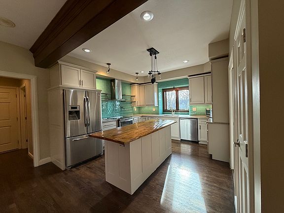 Glass subway tile backsplash
Newer Cabinets, Hardwood Floors