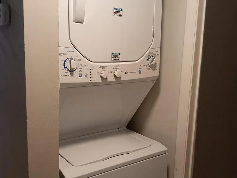 Washer and drayer are conveniently located off the hallway.