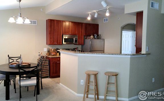 Kitchen open to dining and living rooms