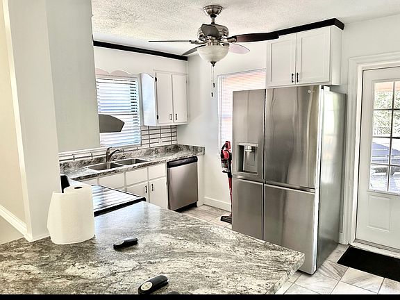 Gorgeous kitchen remodel. Plenty of of cabinets.