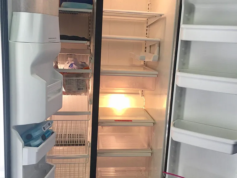 Available to use as needed - large "overflow" refrigerator in garage