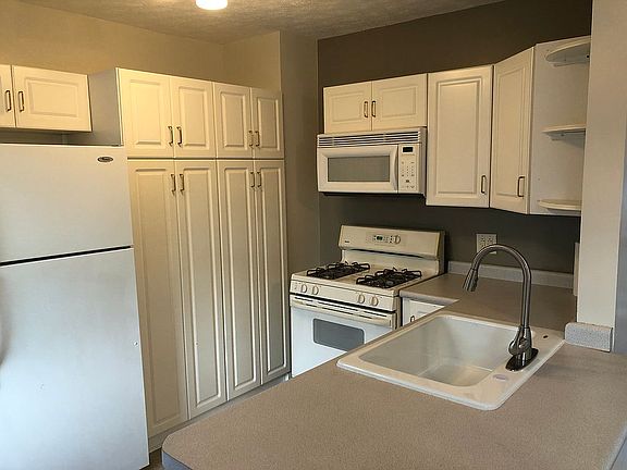 Cozy kitchen with gas range.