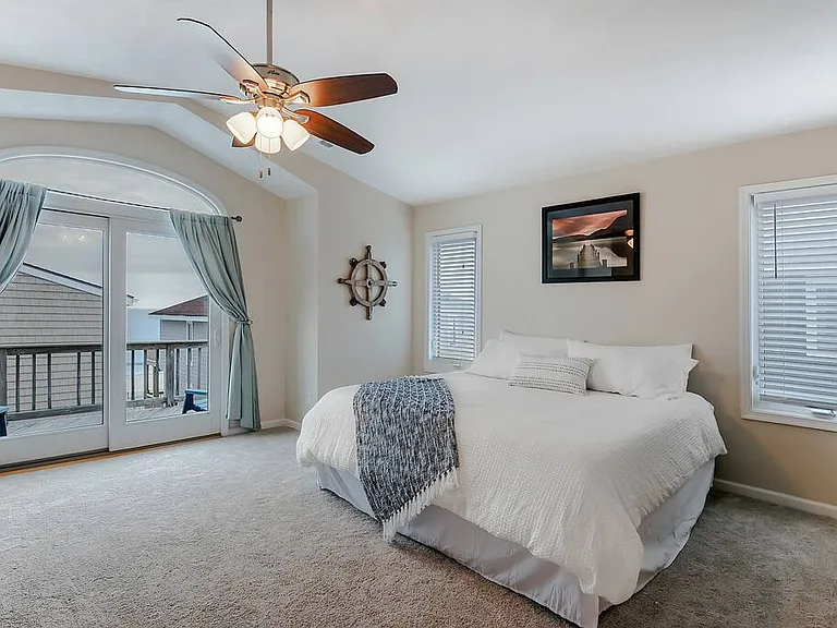 Spacious master suite on 3rd floor with King bed and a balcony overlooking the ocean.
