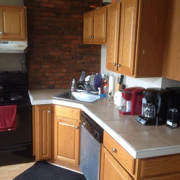 Eat - in kitchen with exposed brick
