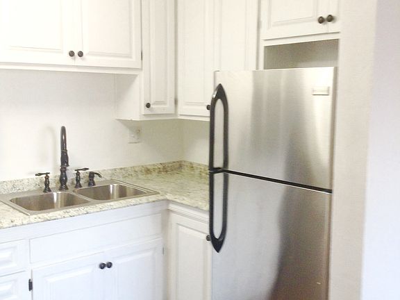 9-inch deep double sink and large, house-size refrigerator