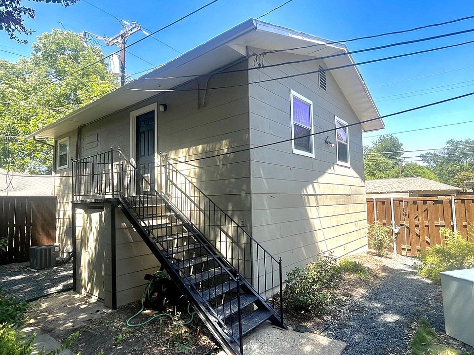 Photo from the backyard and looking up into the garage unit.