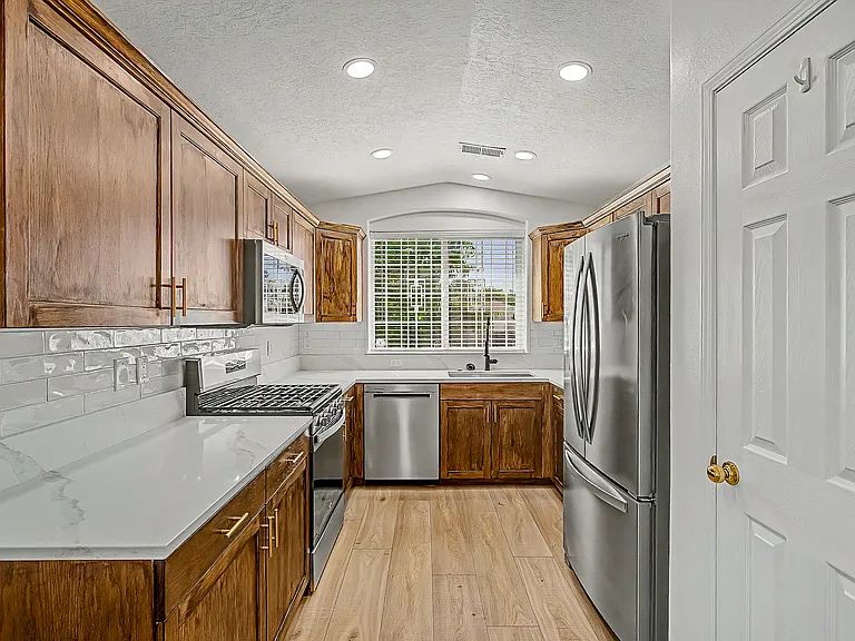 Kichen with all new appliances. Food pantry access.