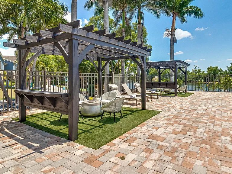 Lounge in style underneath our poolside pergolas!