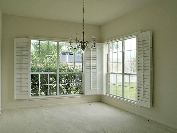 Formal dining room off entry features updated shutters!