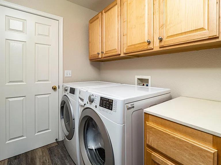 In house laundry rooom with storage