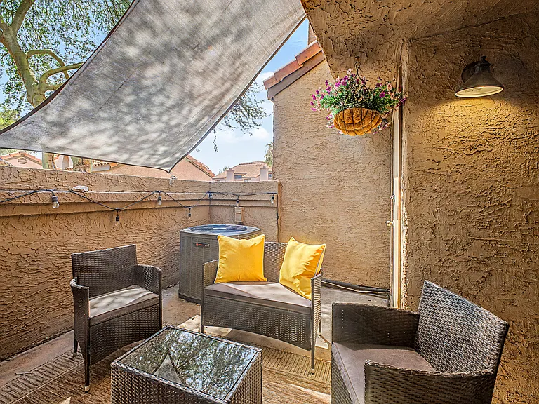 Outdoor seating area provides the ideal spot for soaking up the sun or enjoying an evening with cafe lights and friends.